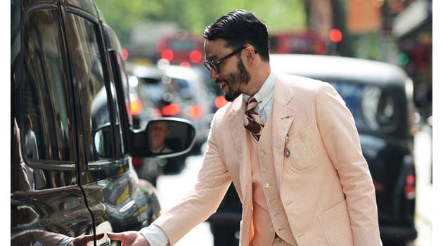Guy in Linen Suit grabbing a London Taxi