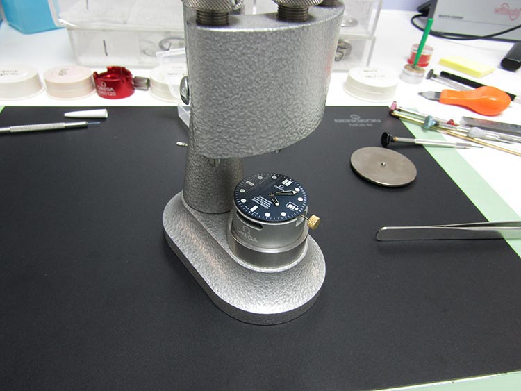  “Fascia is re-attached to the watch, ready to be installed in the case” Omega Watch