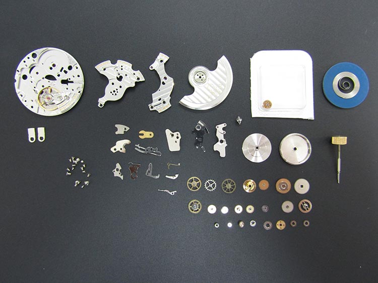 “Watch movement fully disassembled – exquisite jewels within the watch” Omega watch