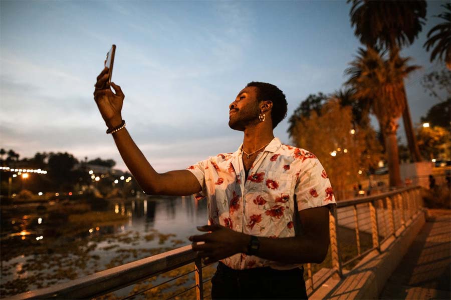 men taking a selfie by night